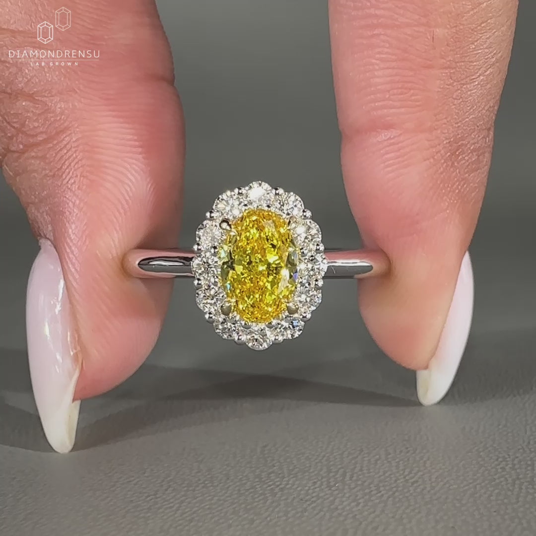 Canary yellow oval diamond ring in white gold.