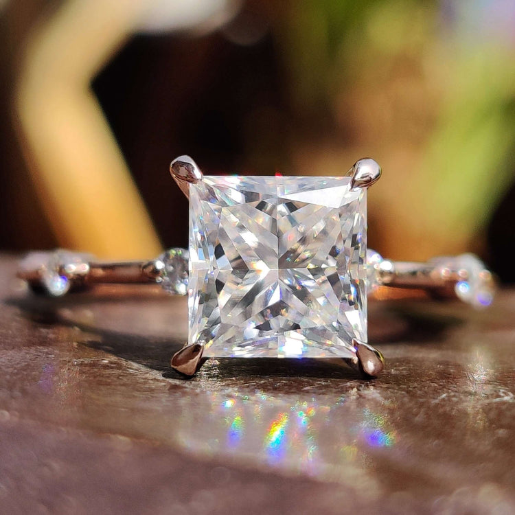 Princess cut moissanite ring in rose gold.