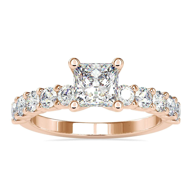 Princess cut diamond ring with round pave band in white gold.