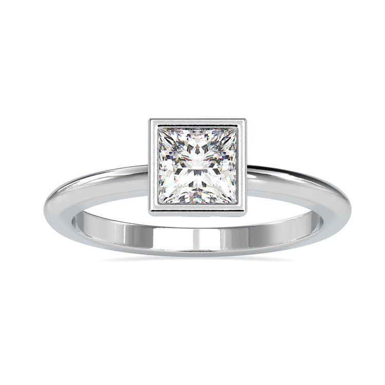 Handmade ring featuring bezel solitaire with lab grown princess diamond.