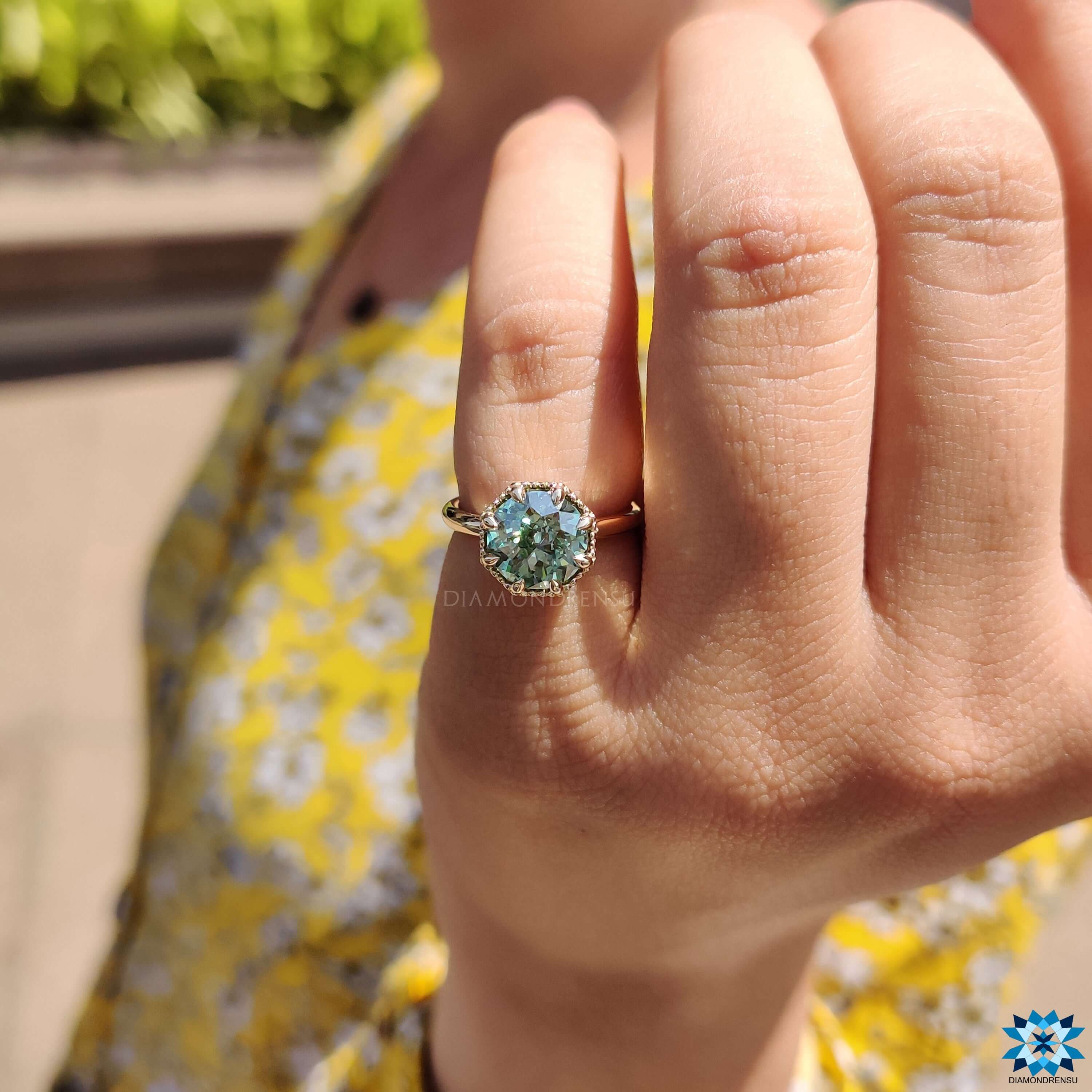 Green Jubilee cut moissanite ring in yellow gold.