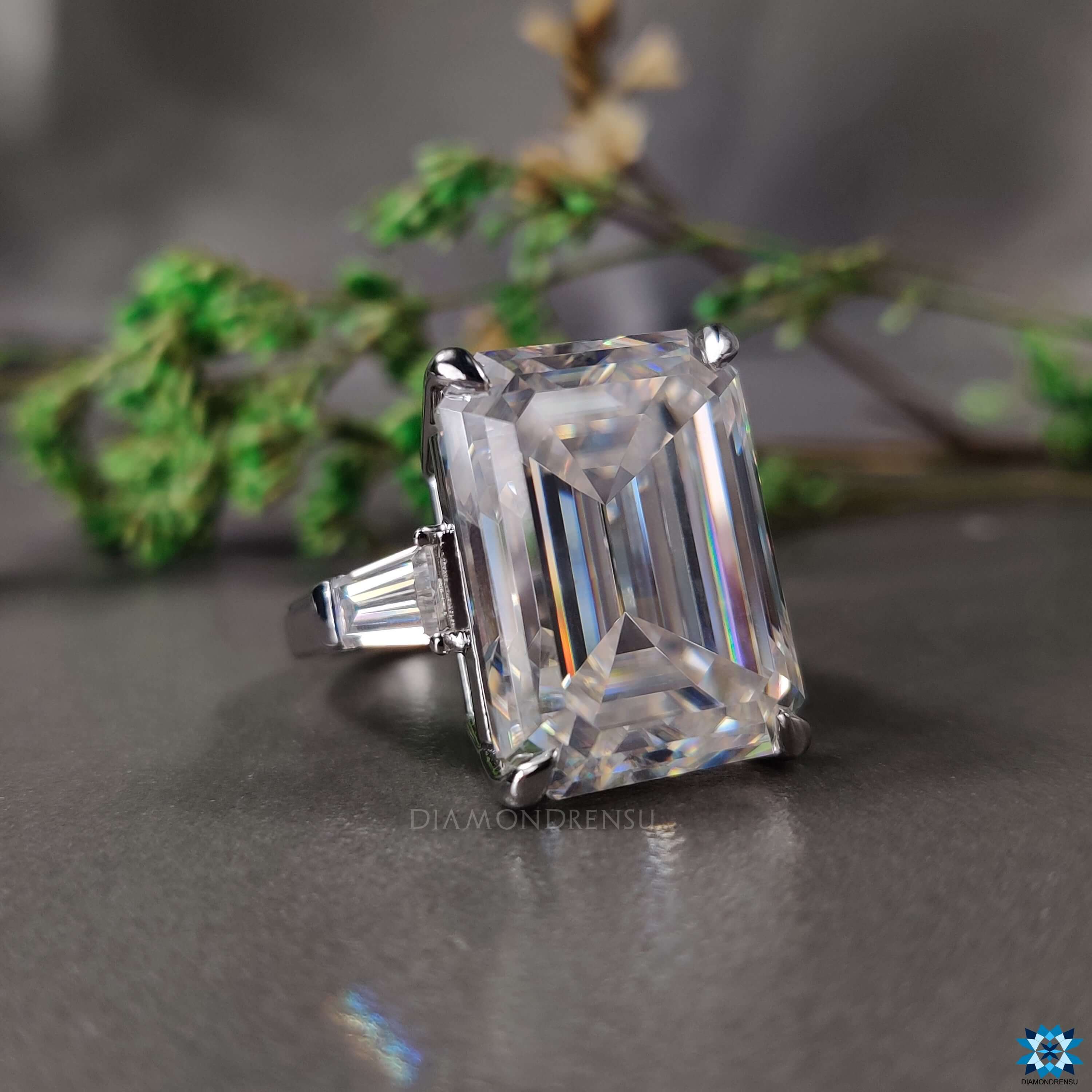 Moissanite engagement ring with 4 prong claw setting.