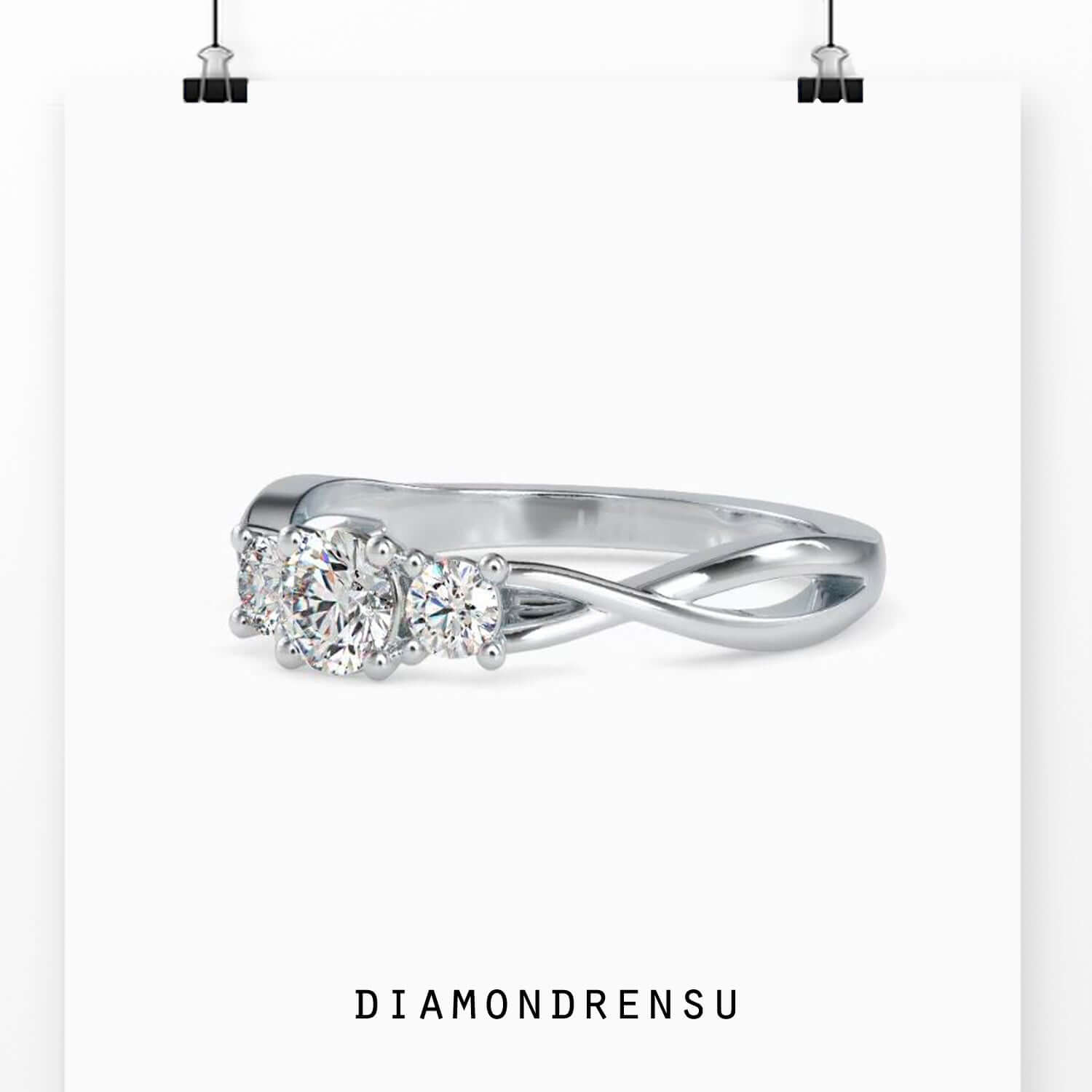 Infinity style custom engagement ring with 3 round diamonds.