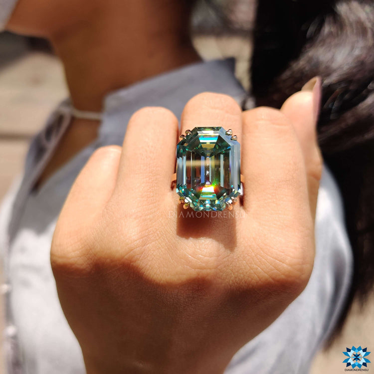 Emerald Krupp cut moissanite solitaire ring in rose gold.