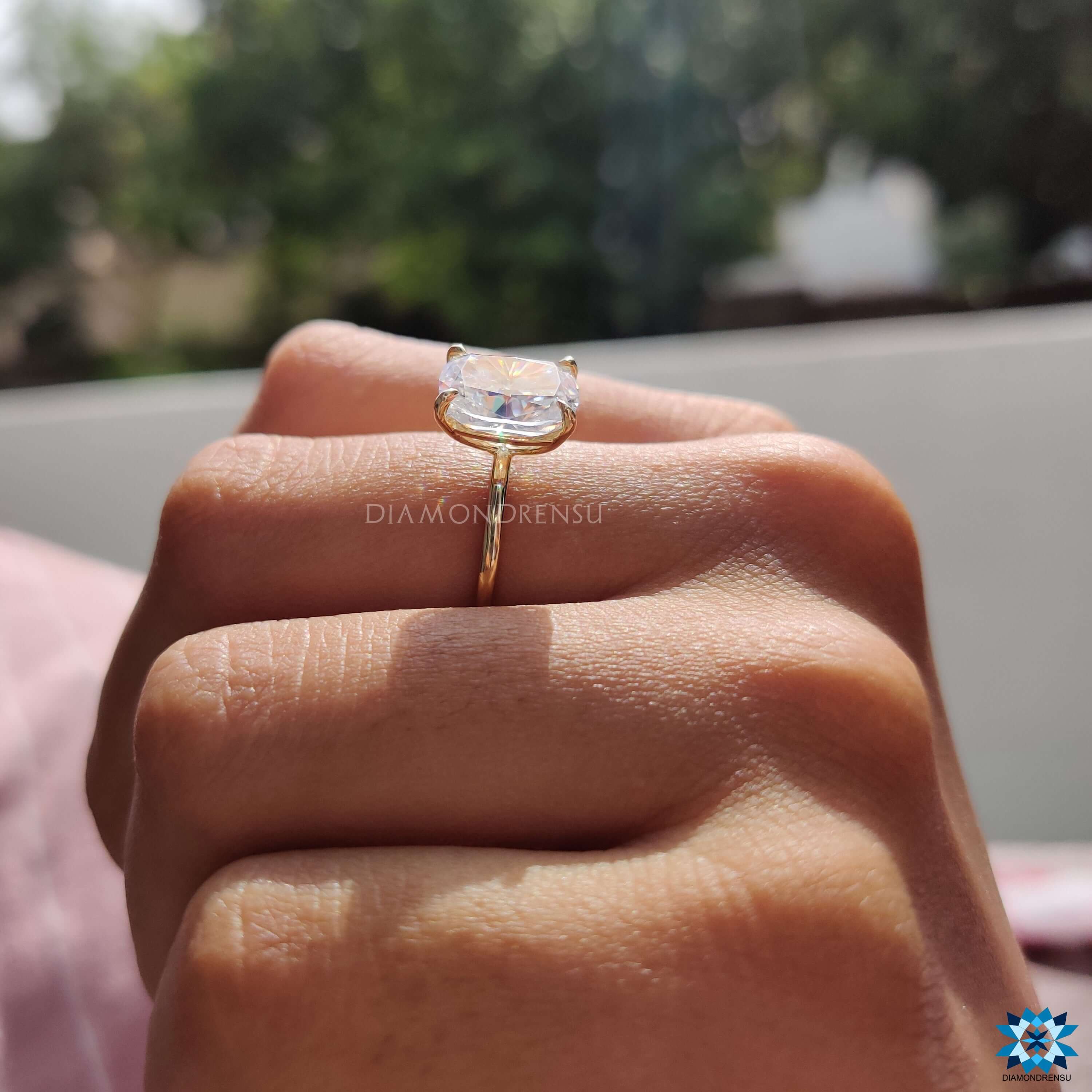 Custom engagement ring featuring an elongated cushion cut moissanite.