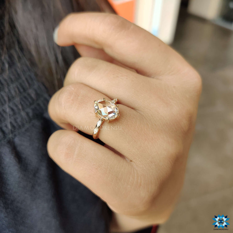 Handmade yellow gold ring with rose cut oval moissanite.