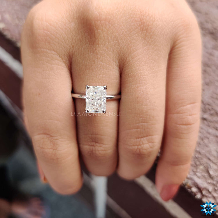 Radiant cut moissanite ring in a classic white gold solitaire design.