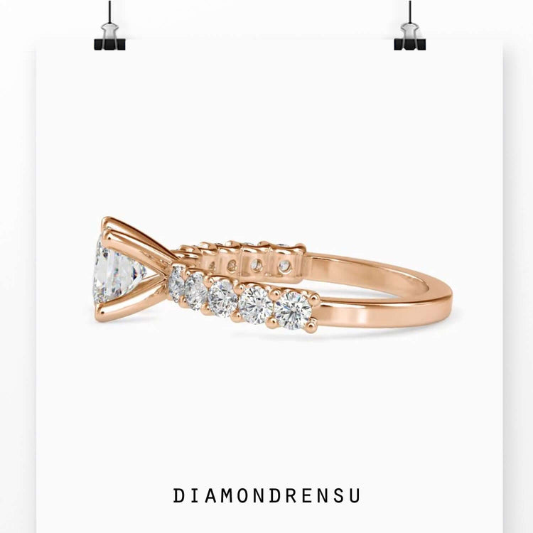 Handmade princess cut ring with round prong setting in gold.