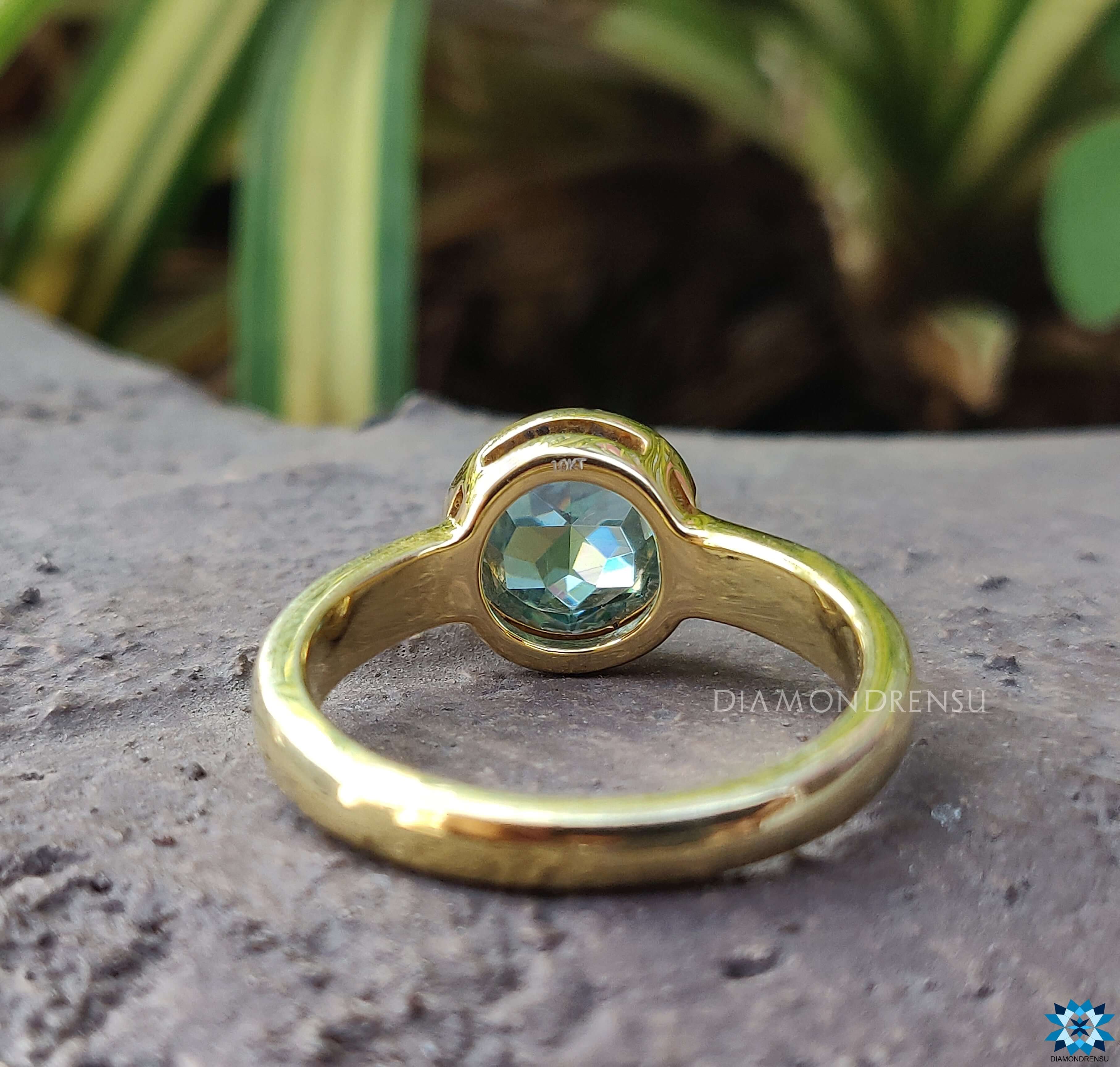 Modern bezel setting ring offering a sleek and secure design.