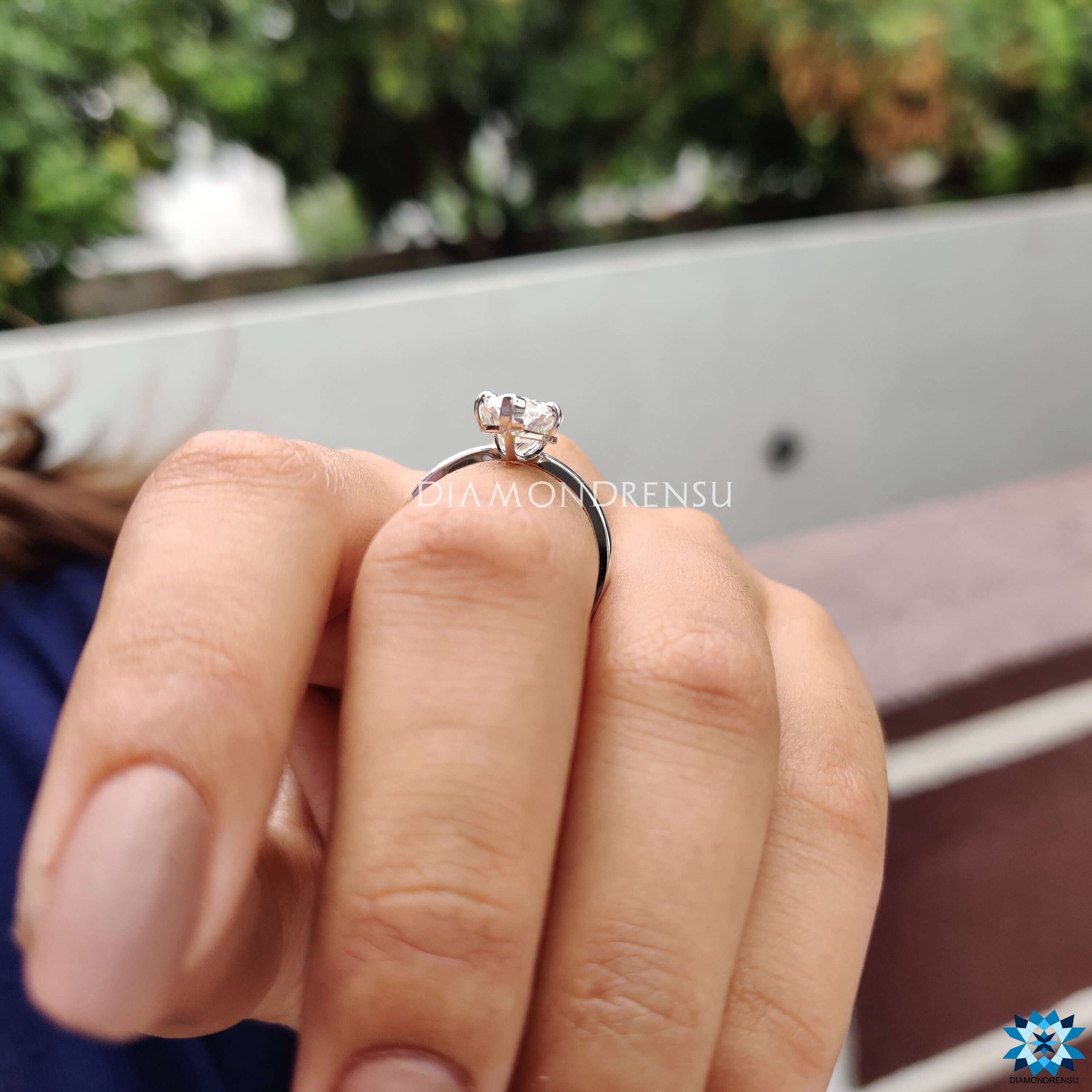 Diamondrensu UK ring with upside down moissanite set in solitaire white gold design.
