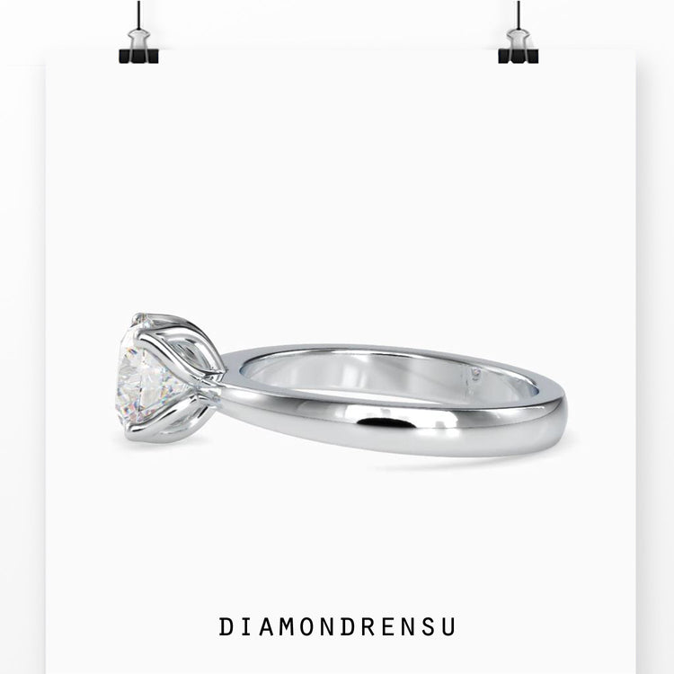 Tapered shank ring with IGI certified round diamond.