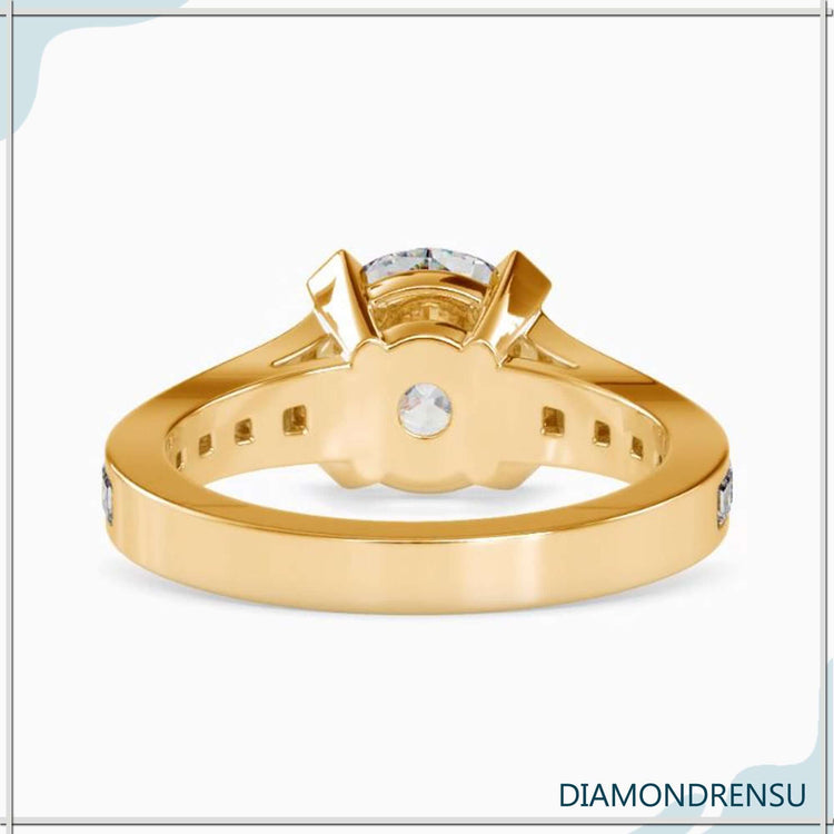 Yellow gold ring with trapezium pave band and lab diamond.
