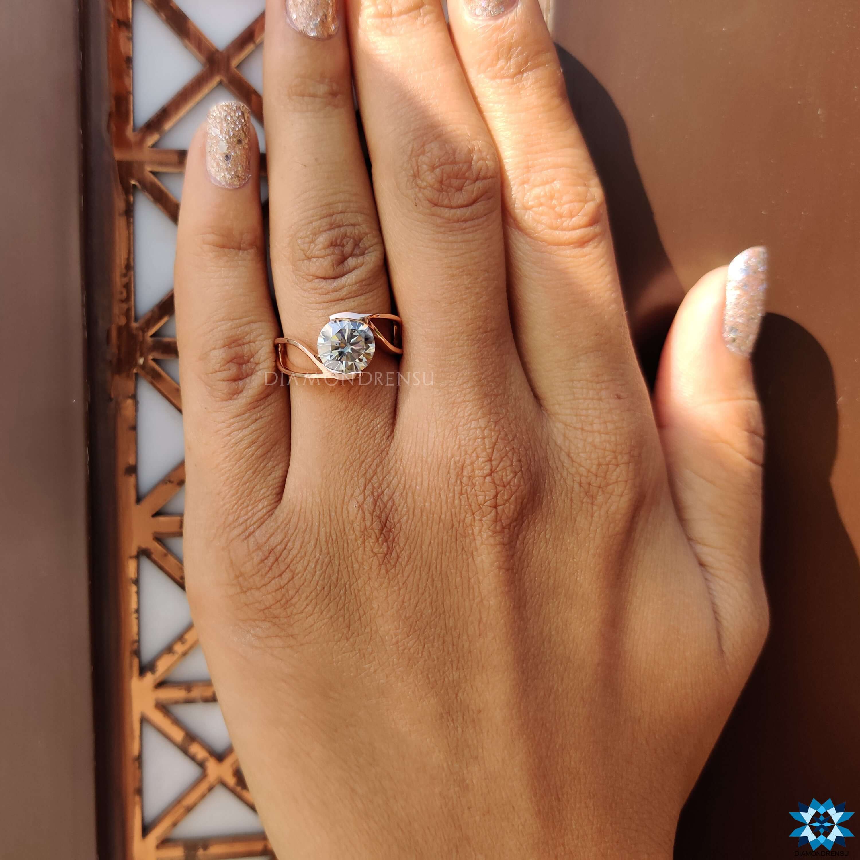 Modern engagement ring with gray round cut moissanite.