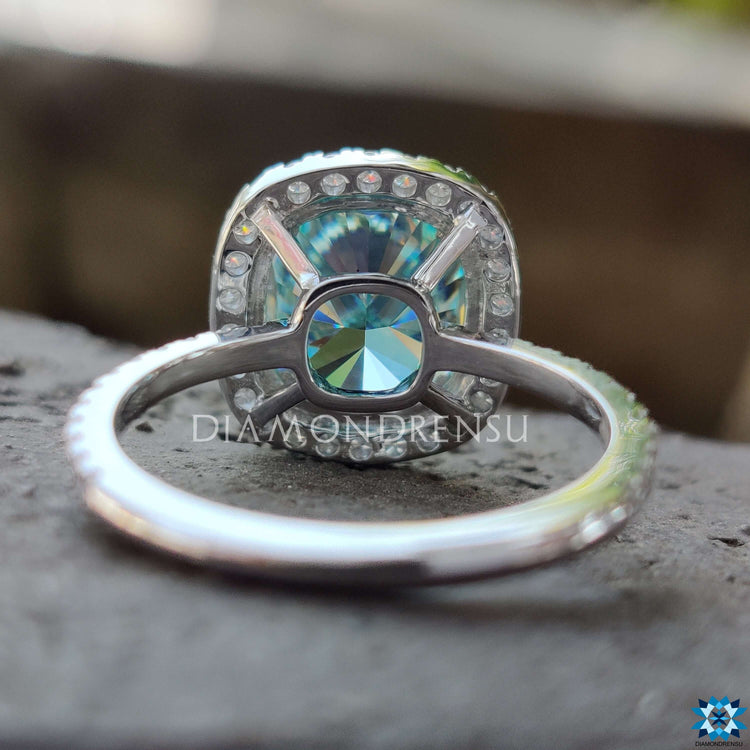 Buy moissanite ring crafted with 4 prong claw setting and cyan blue centre stone.