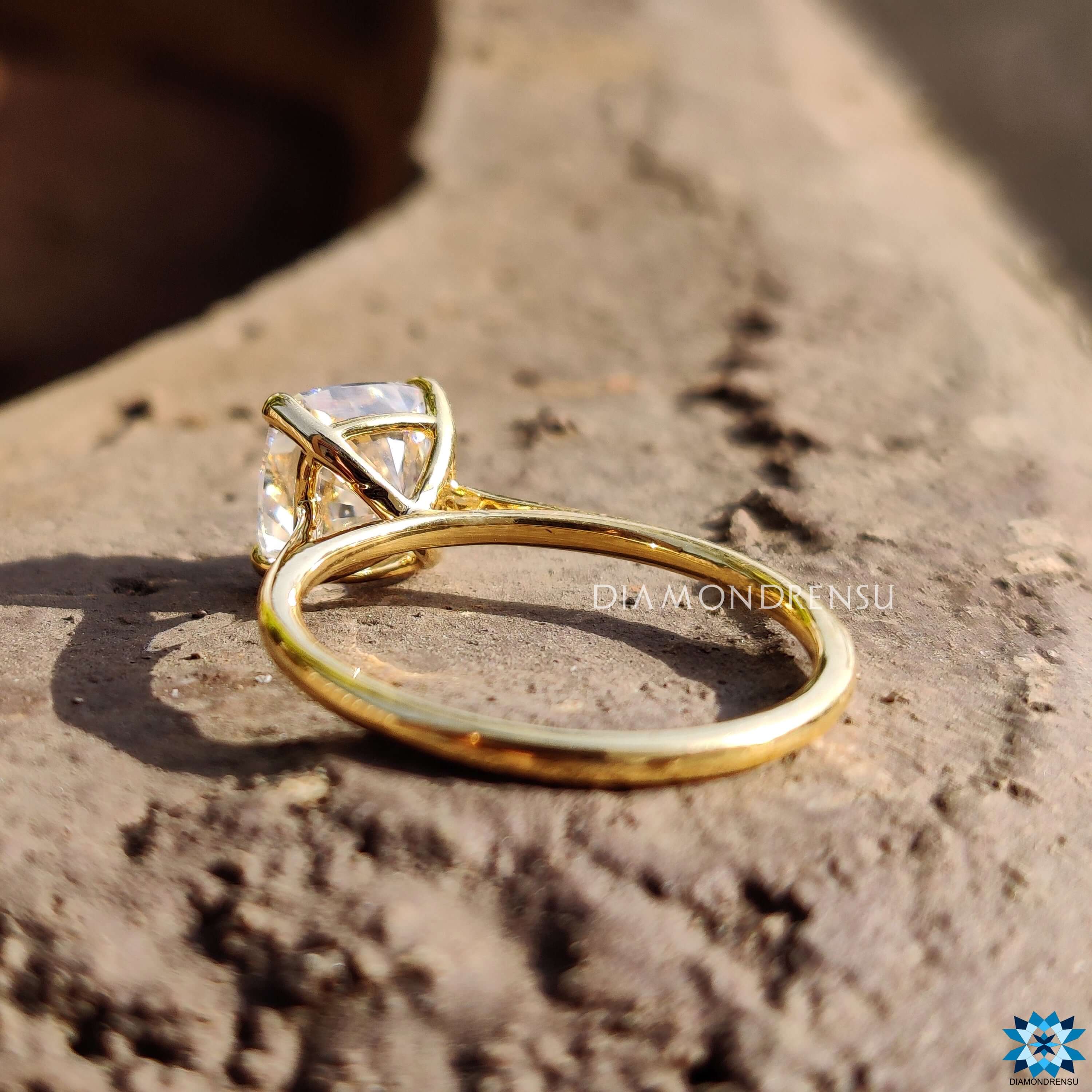 Handmade cushion cut engagement ring with prong setting.