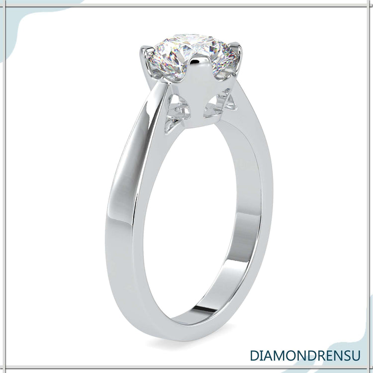 White gold engagement ring with lab grown diamond in basket mount.