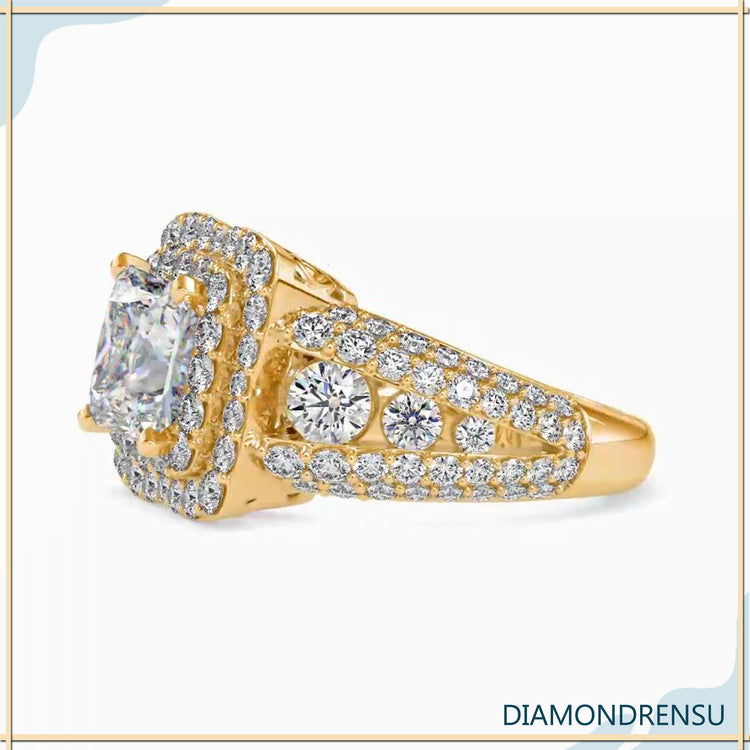 Gold engagement ring with round side stones.