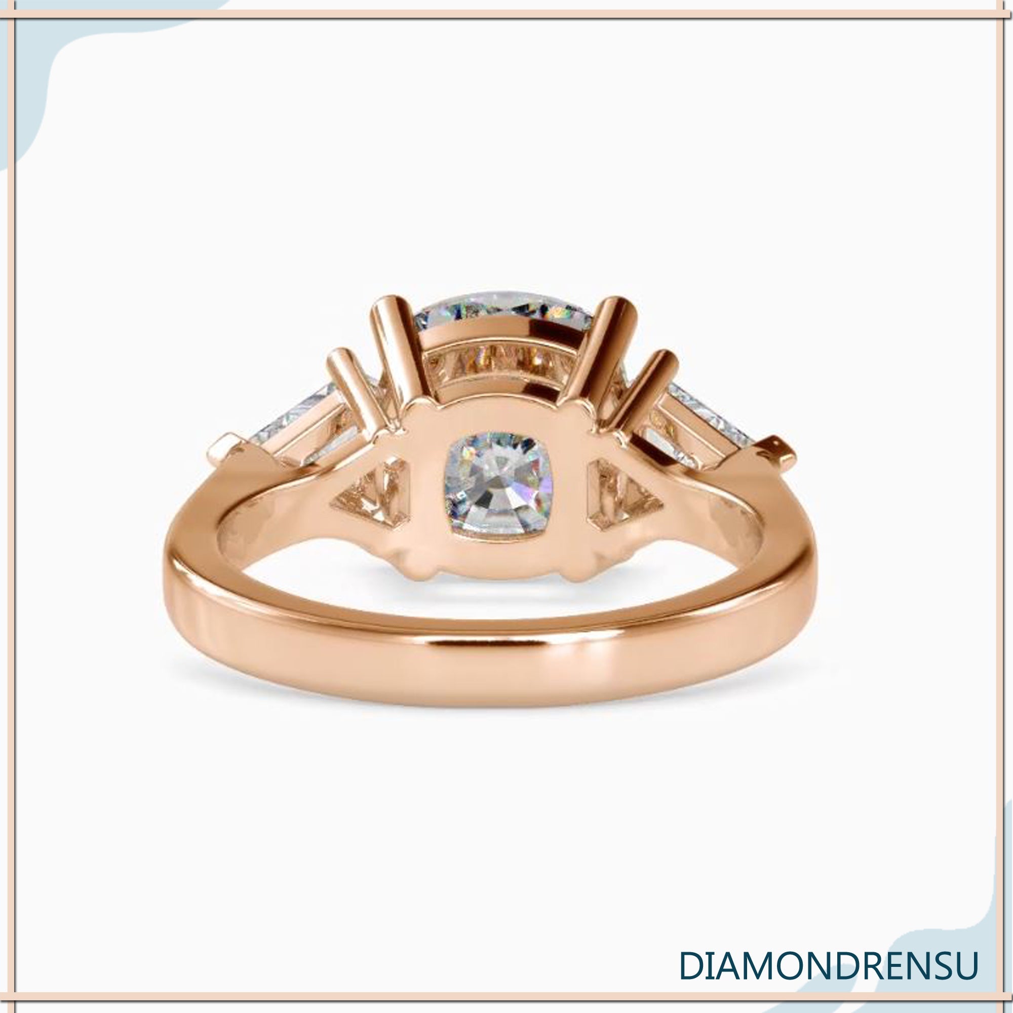 Custom engagement ring with cushion cut and kite diamond trio.