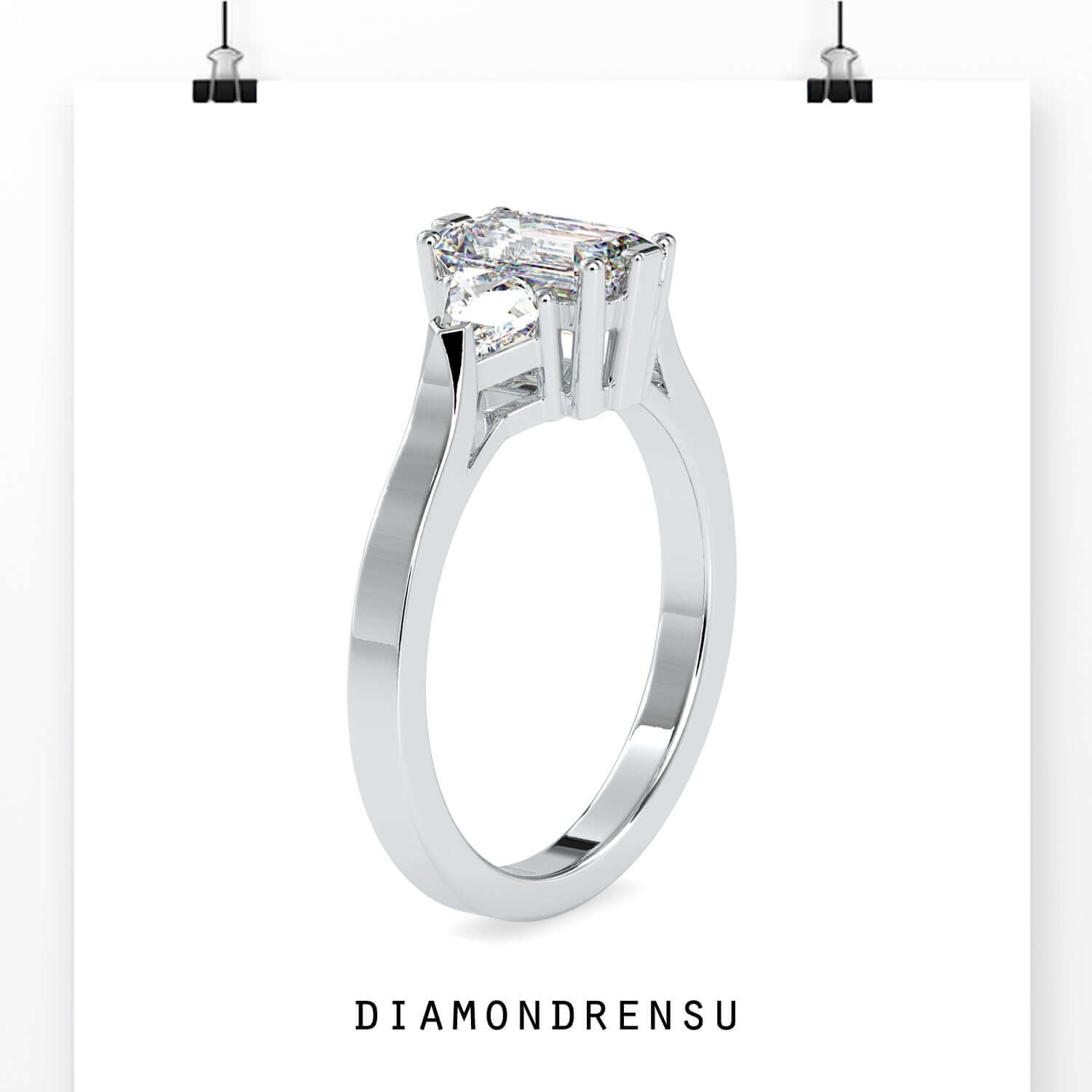 Trillion side stone ring with emerald cut centre in white gold.