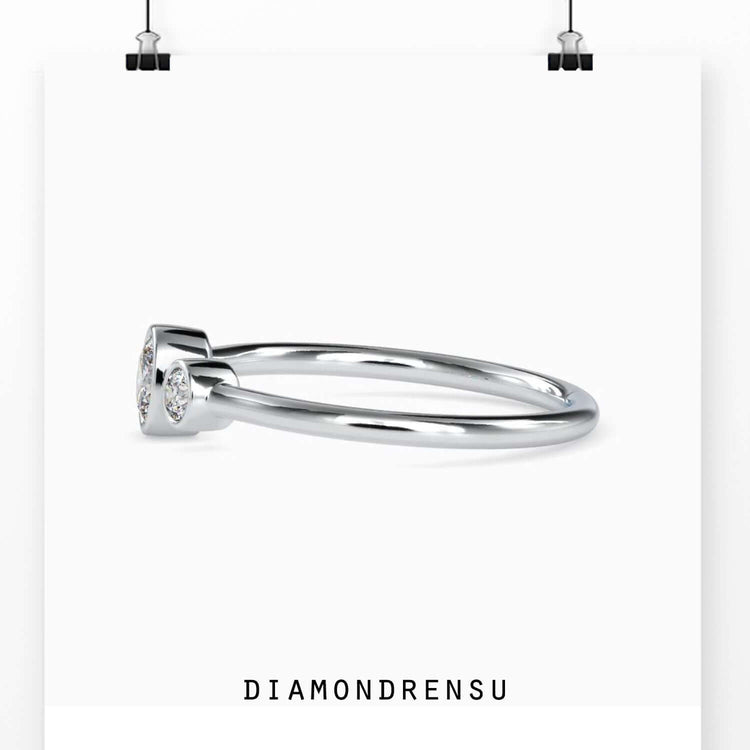IGI certified oval three stone ring in yellow gold band.