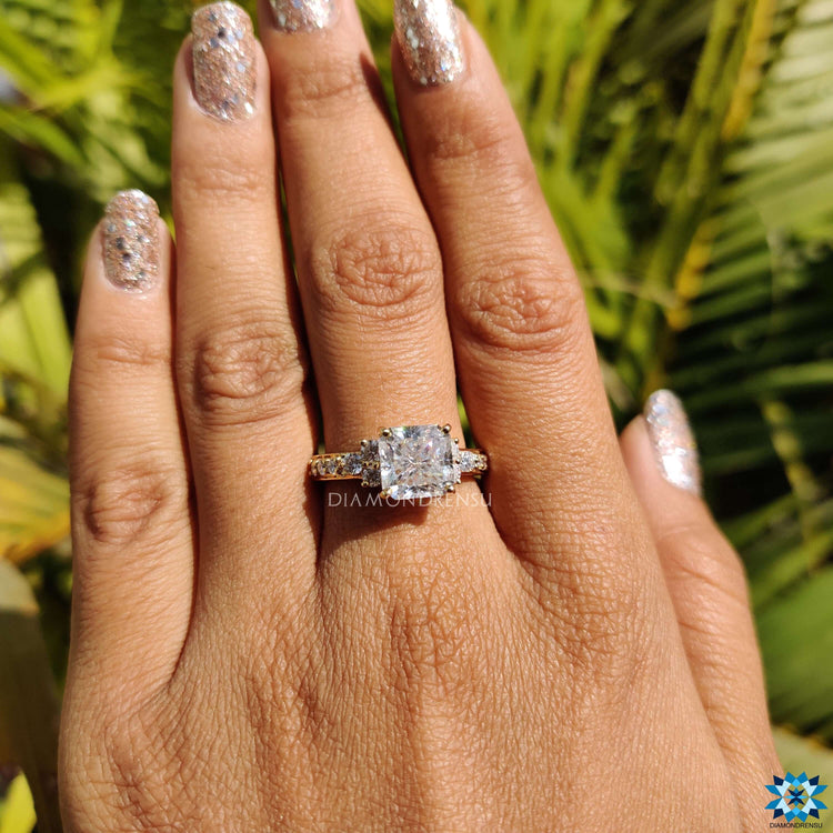 Muse setting ring with round moissanite side stones.