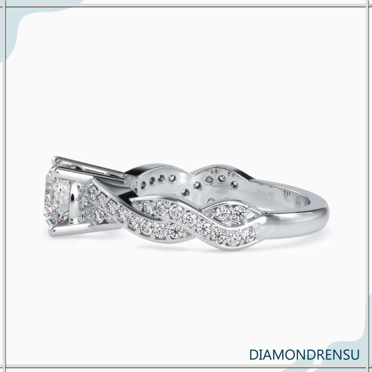 Buy diamond ring with twisted band and round cut centre.