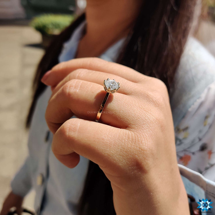 Moissanite engagement ring with 8 prong setting.