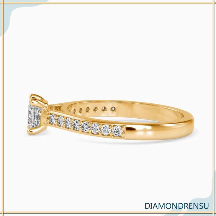 Lab grown diamond ring with channel set side stones.