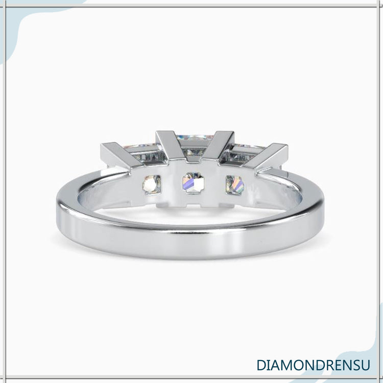 Lab grown diamond ring with three stone princess cut design.