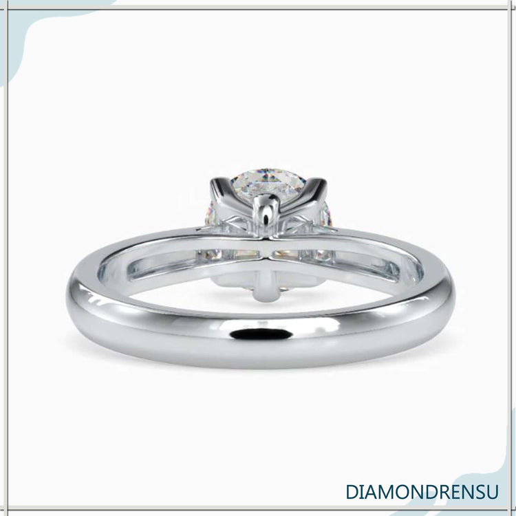 Yellow gold diamond ring featuring a single round stone, perfect for a bold and radiant style.