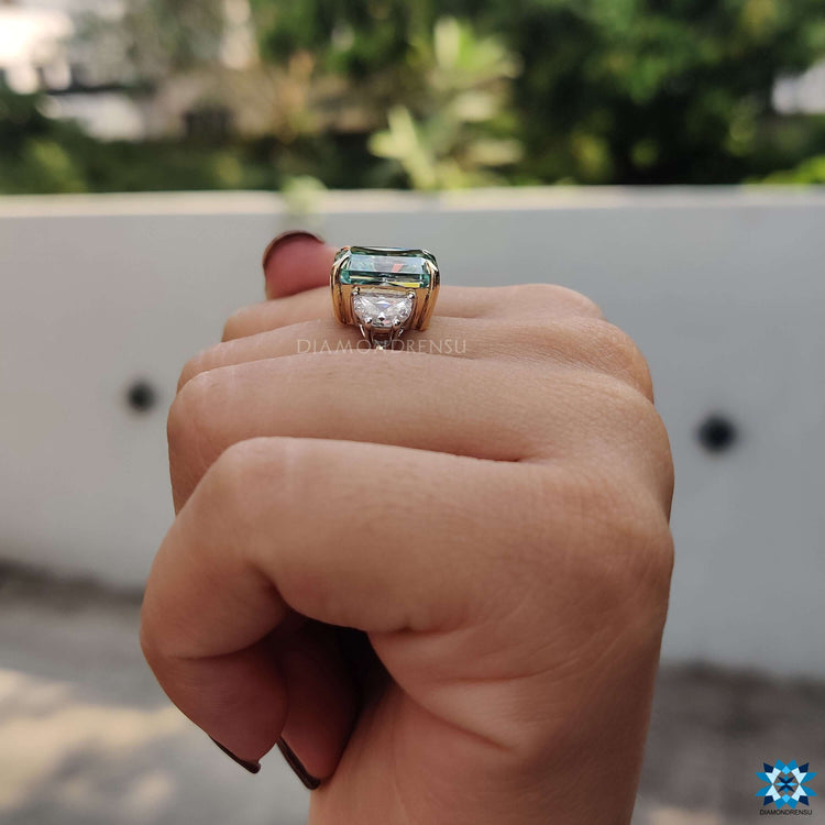 Blue moissanite ring with half moon accents.
