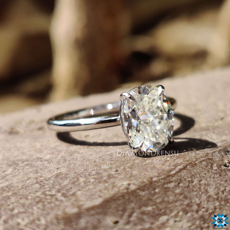 Custom solitaire ring with oval moissanite.