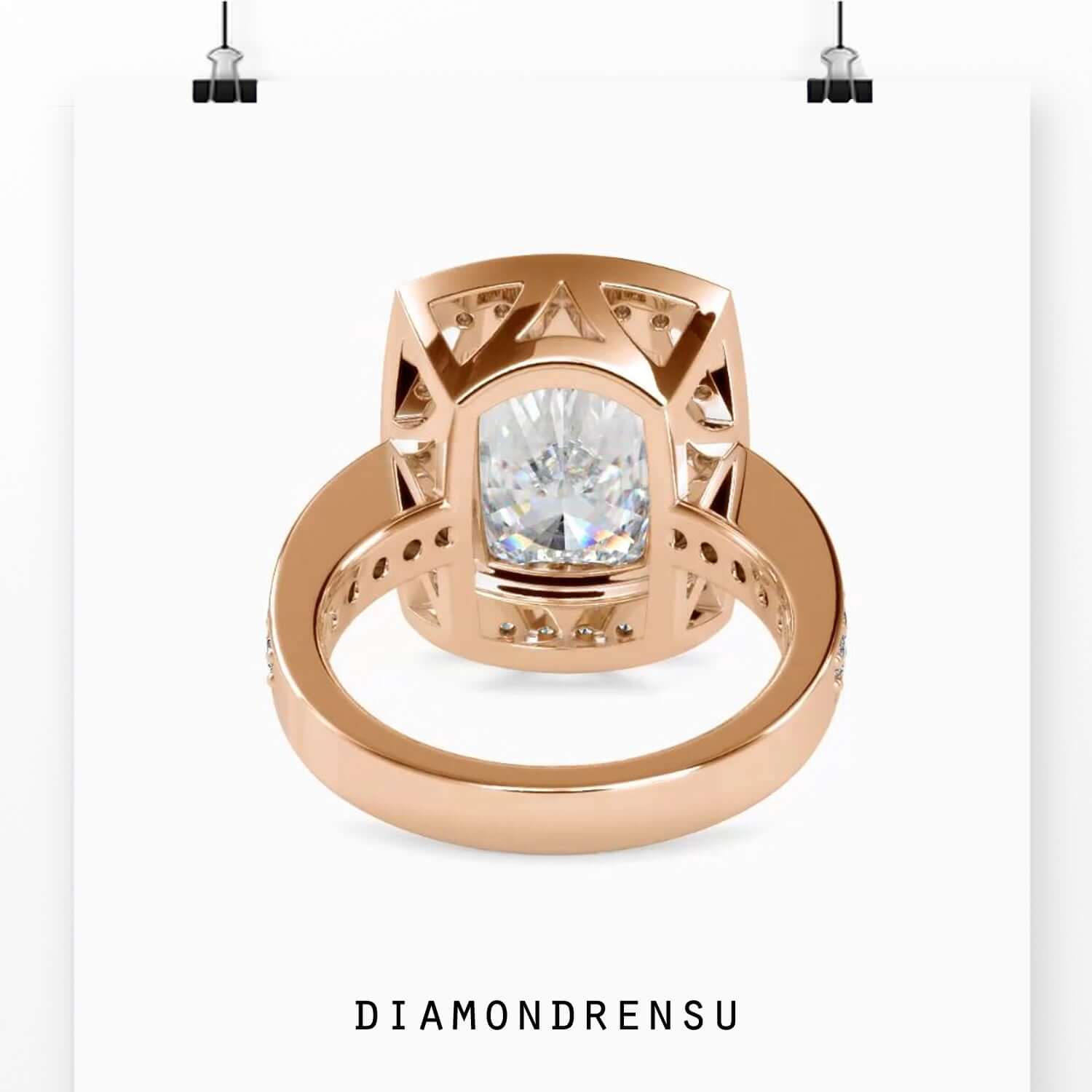 Round cut pave band ring with elongated cushion diamond.