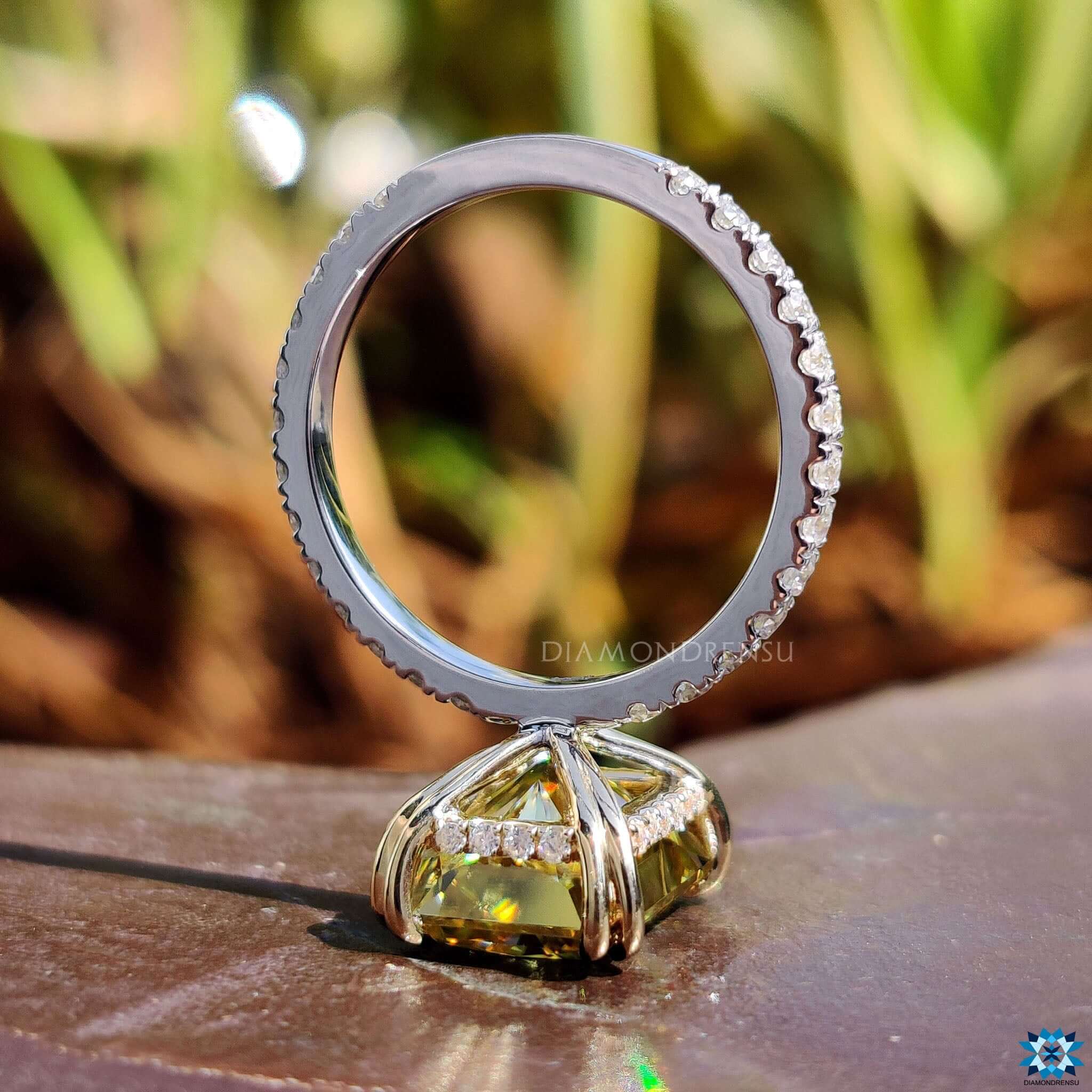 Two tone engagement ring with radiant moissanite.