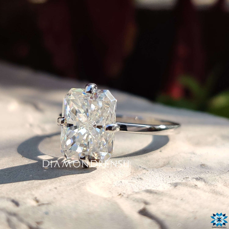 Four prong setting radiant cut moissanite ring.
