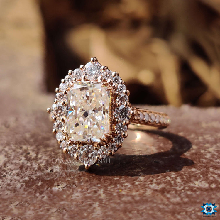 Custom moissanite halo ring with radiant cut and prong setting.