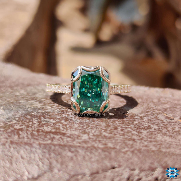 Pave setting ring with round cut moissanite accents.