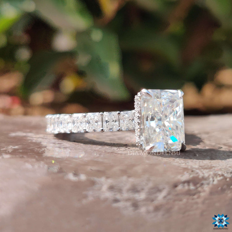 Hidden halo ring featuring radiant cut moissanite.