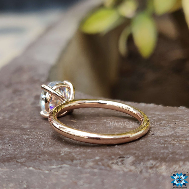 A sophisticated moissanite solitaire ring displayed on a delicate background, highlighting its clarity and craftsmanship.