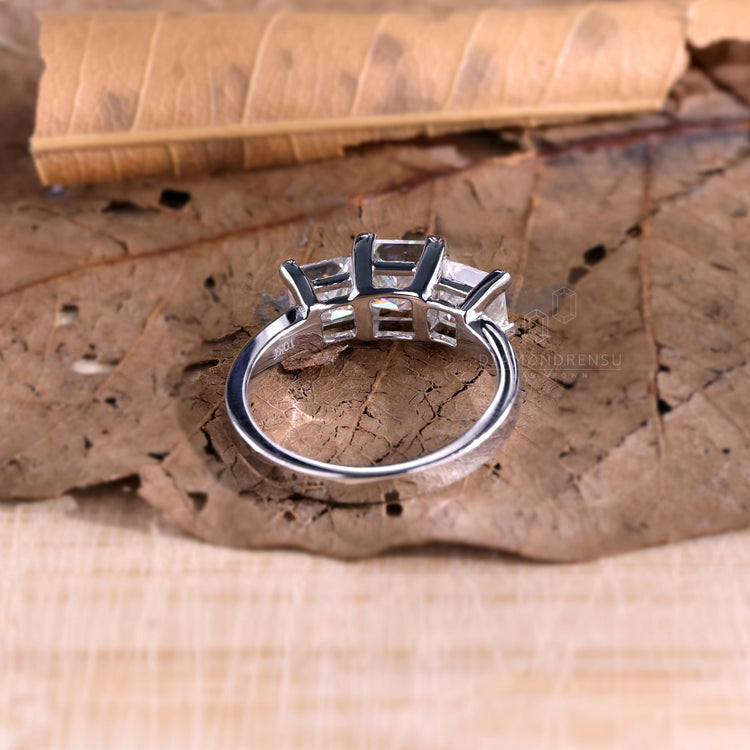 Basket setting diamond ring showcasing a princess cut centre.