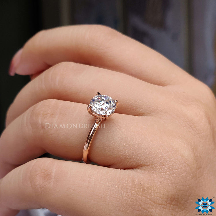 A classic engagement ring round style crafted in a stunning rose gold solitaire engagement ring design, ideal for romantic gestures.