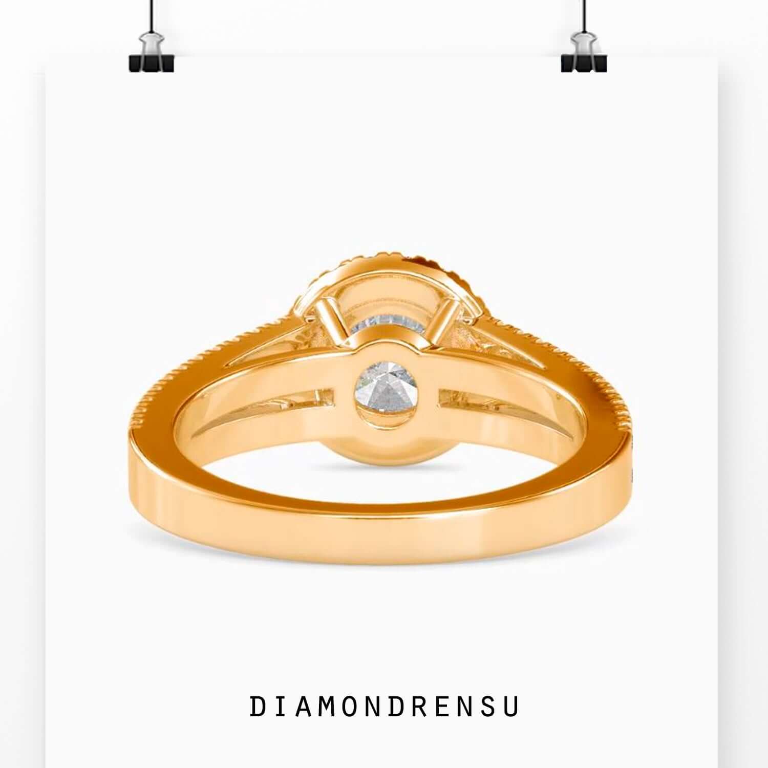 Yellow gold halo ring with lab grown diamond.
