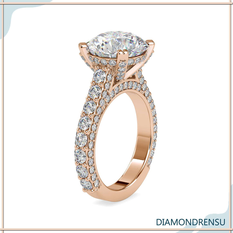 Round cut diamond set in double prong cathedral ring.