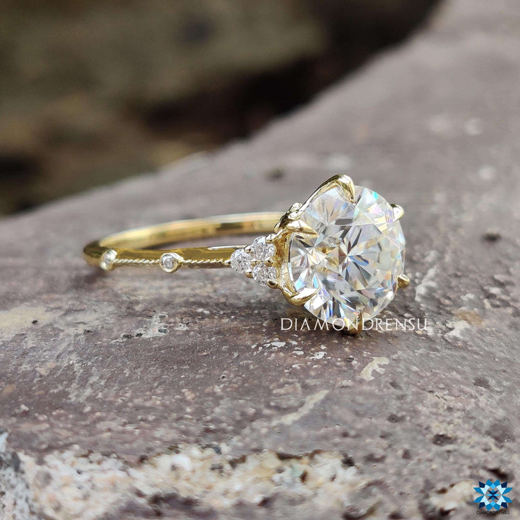 White gold vintage engagement ring with round moissanite.