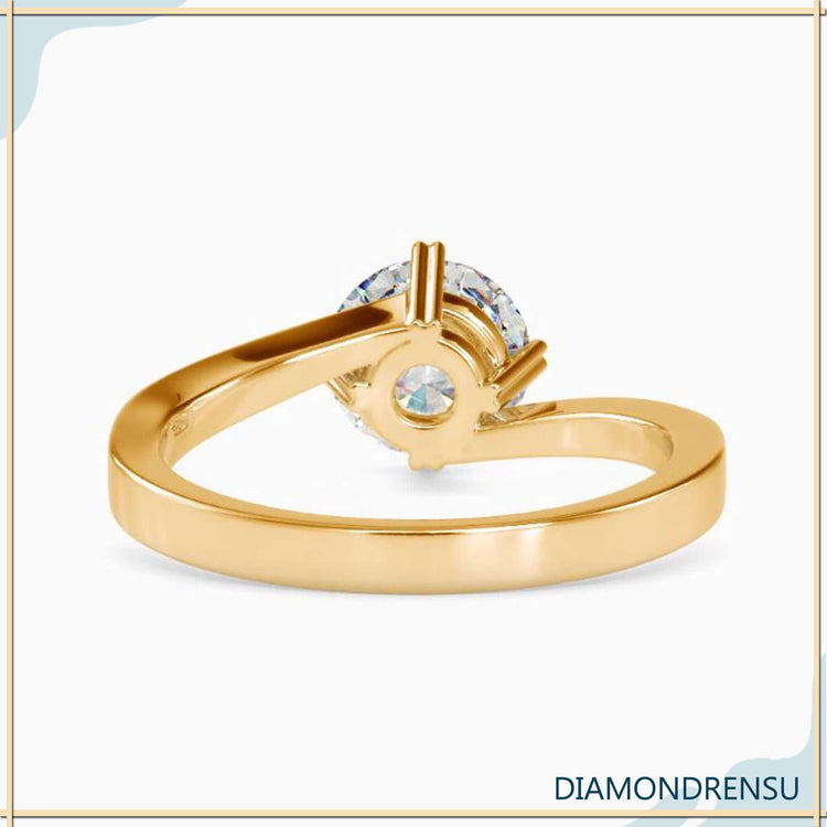Yellow gold ring with round diamond and 4 prong heart setting.