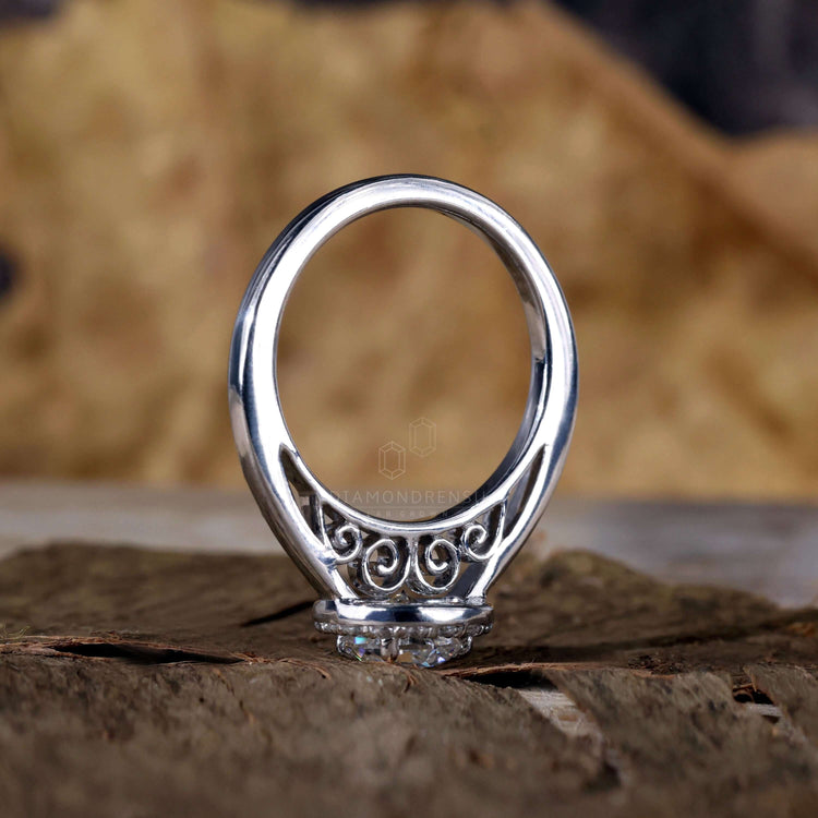 Round brilliant cut diamond with a 4 prong engagement ring design