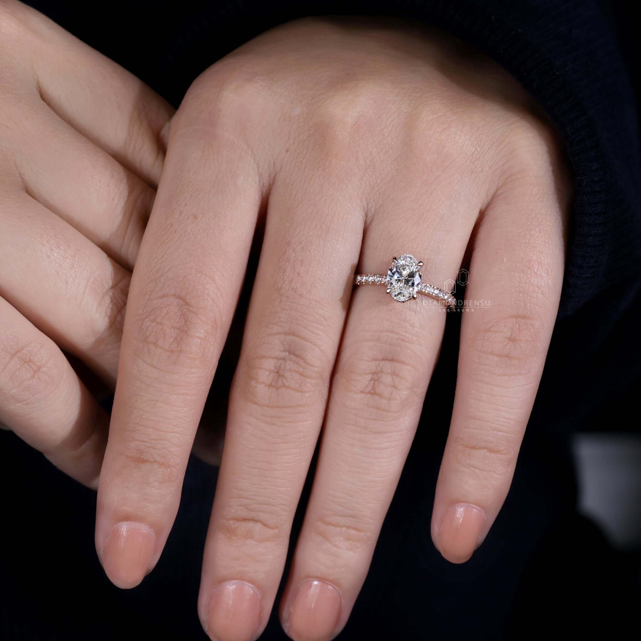 Hidden halo engagement ring with an oval diamond and pave setting, a perfect uk engagement ring for lasting memories.
