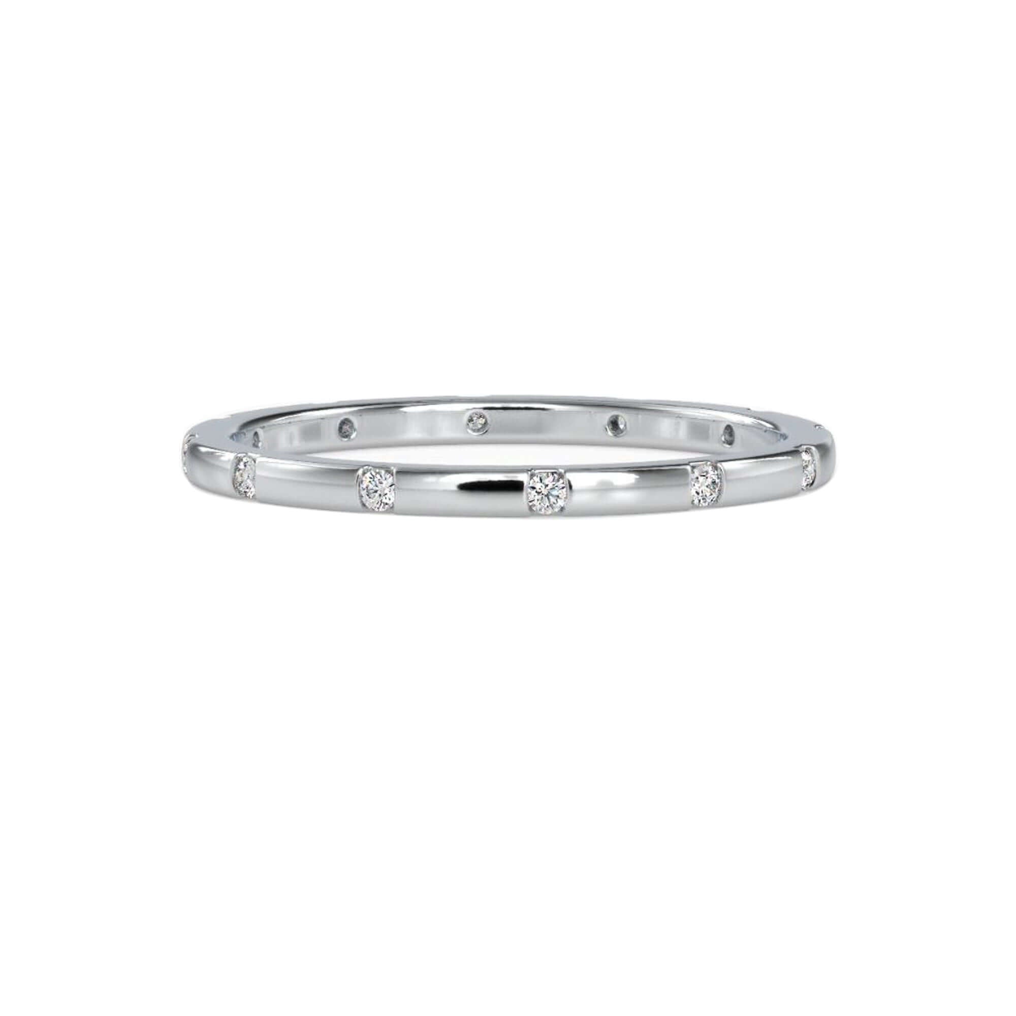 Round cut diamond wedding band in rose gold finish.