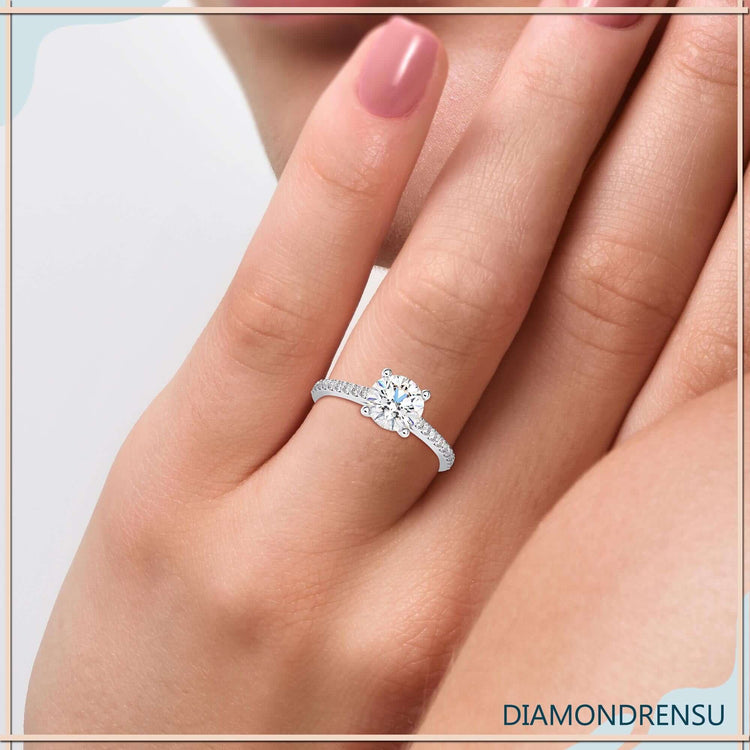 Round diamond ring with 4 prong setting and cathedral design.