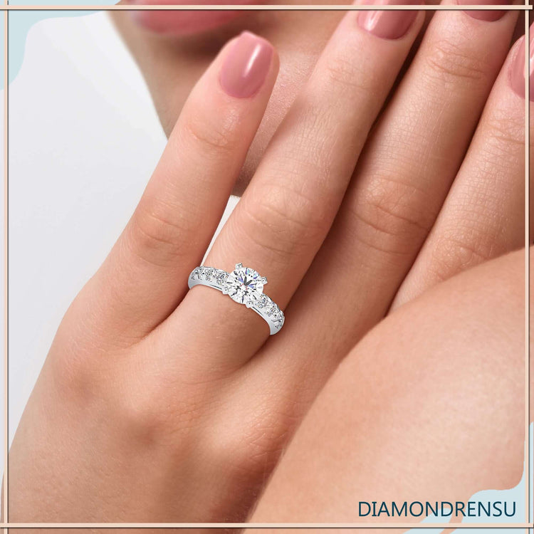 Round cut diamond set in white gold with pave setting.